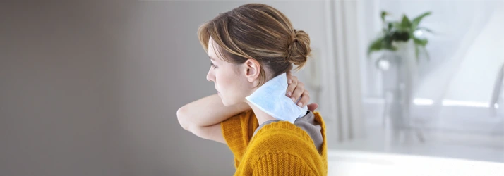 Chiropractic Davidson NC Ice Pack Cryotherapy A person holding an ice pack on their neck.